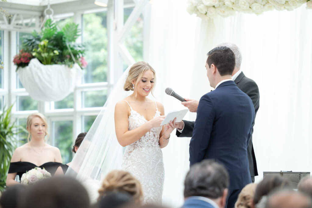 Bride reading vows at wedding ceremony inside NJ Wedding venue