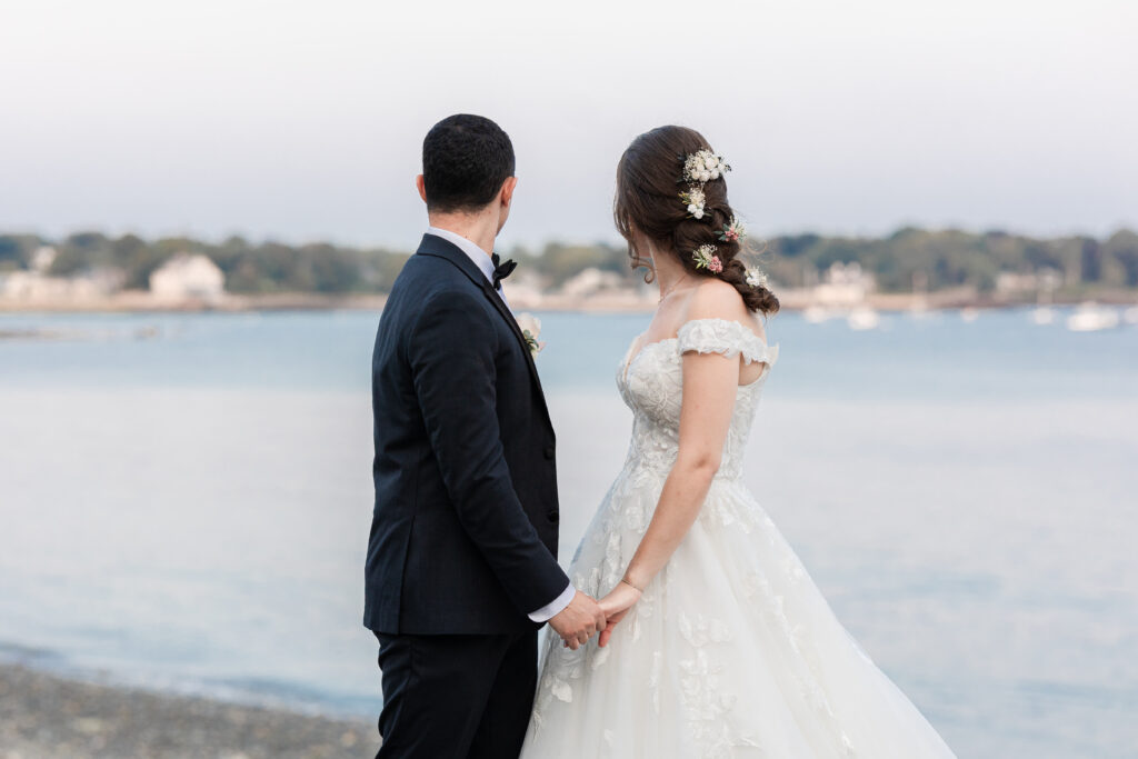 Bride and groom looking into the purple skies