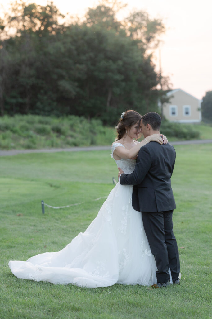 Bride and groom in front of wedding venue