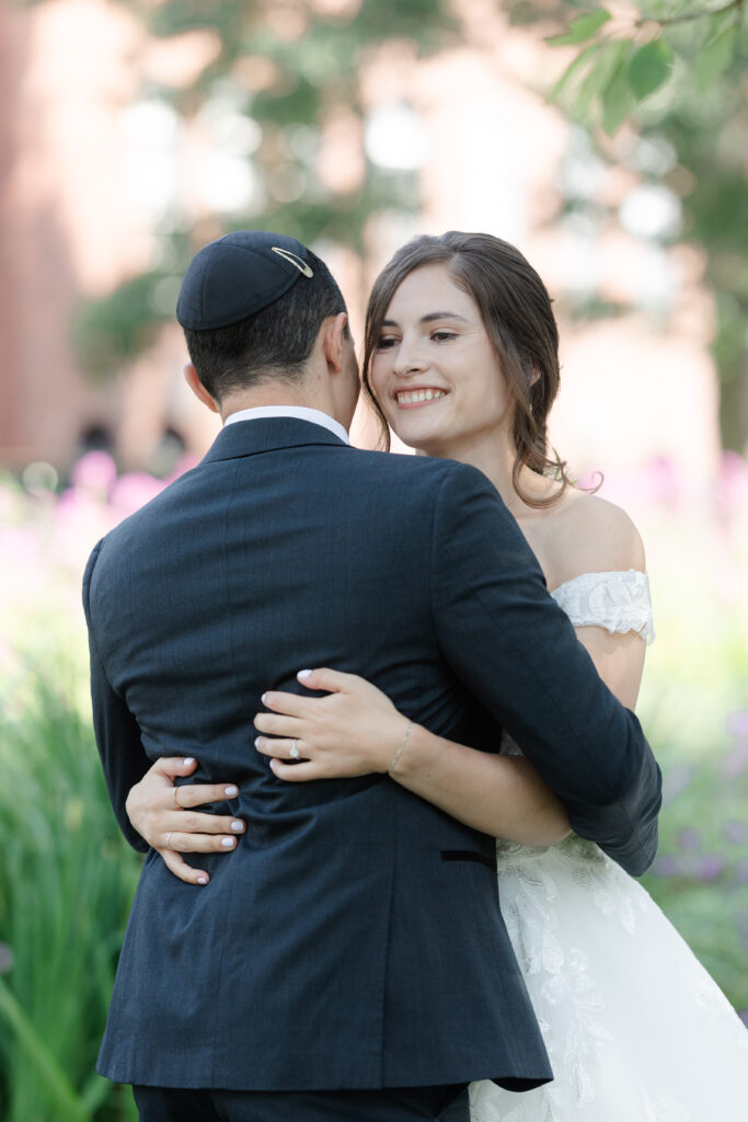 First look between bride and groom outside of Salem Waterfront Hotel