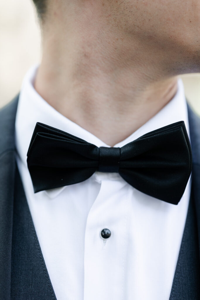 Groom's black bowtie