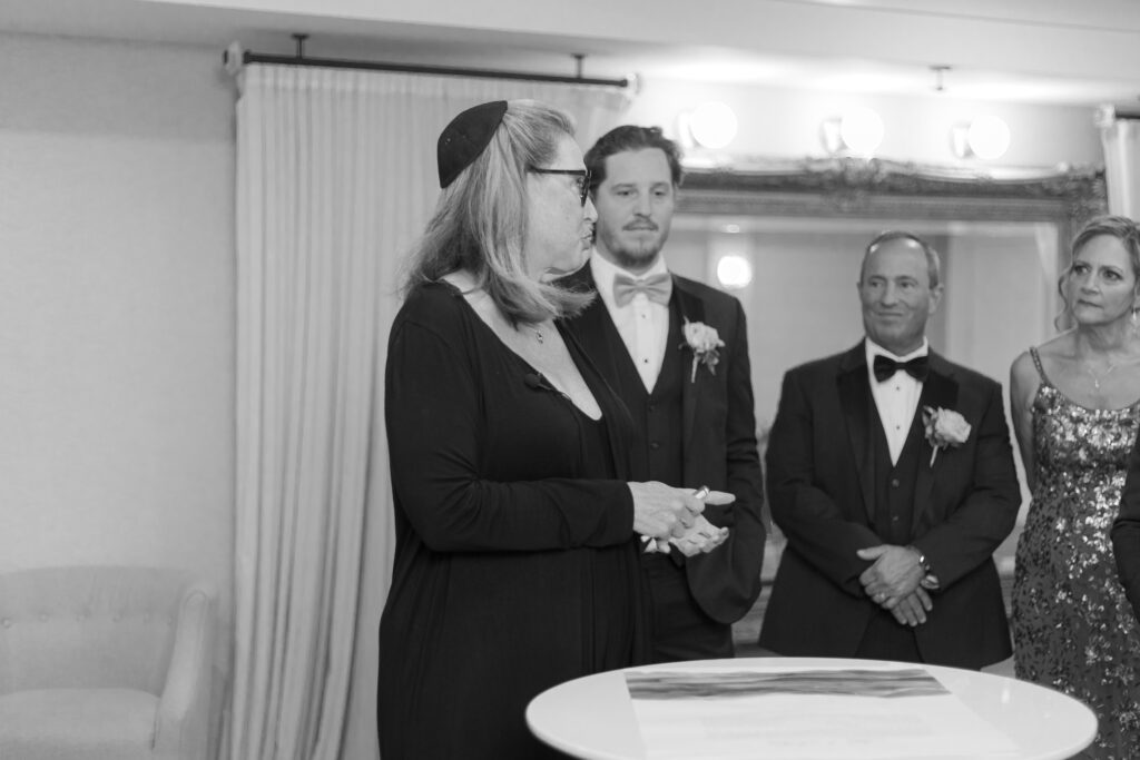 Private signing of ketubah inside wedding venue