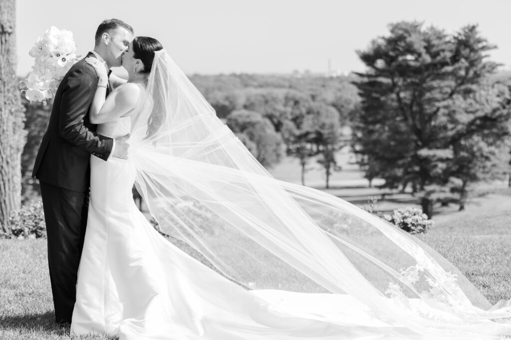 Bride and groom kissing portrait