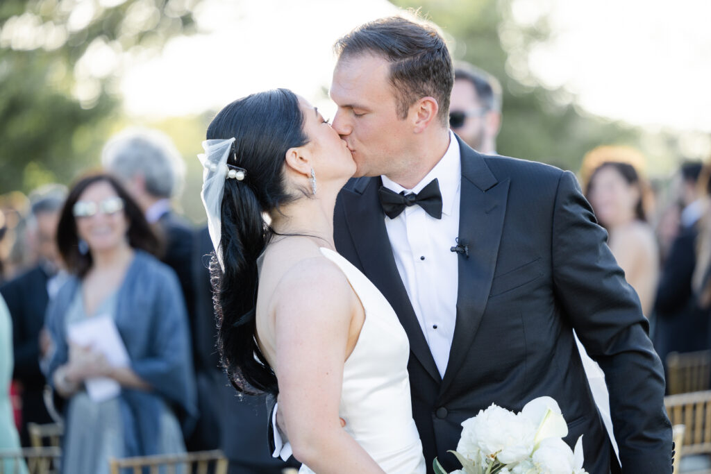 Bride and groom first kiss