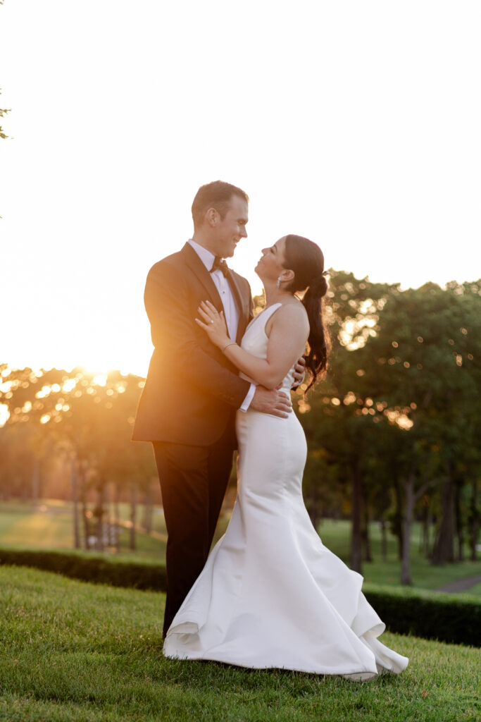 Bride and groom sunset photos outside country club venue