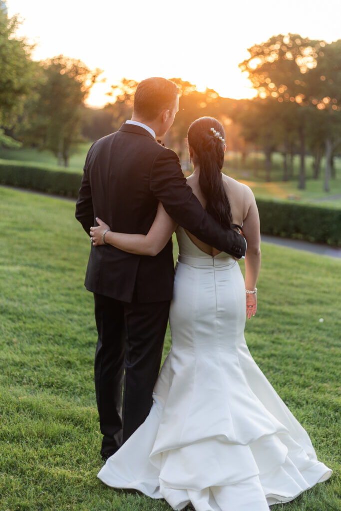 Bride and groom sunset photos outside of Old Westbury Golf Club