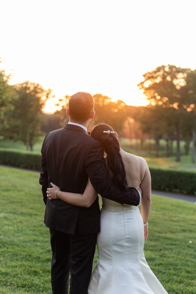 Bride and groom sunset photos outside of Old Westbury Golf Club