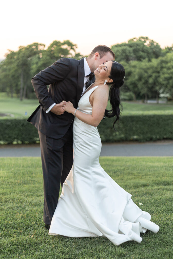 Bride and groom sunset photos outside golf club wedding venue