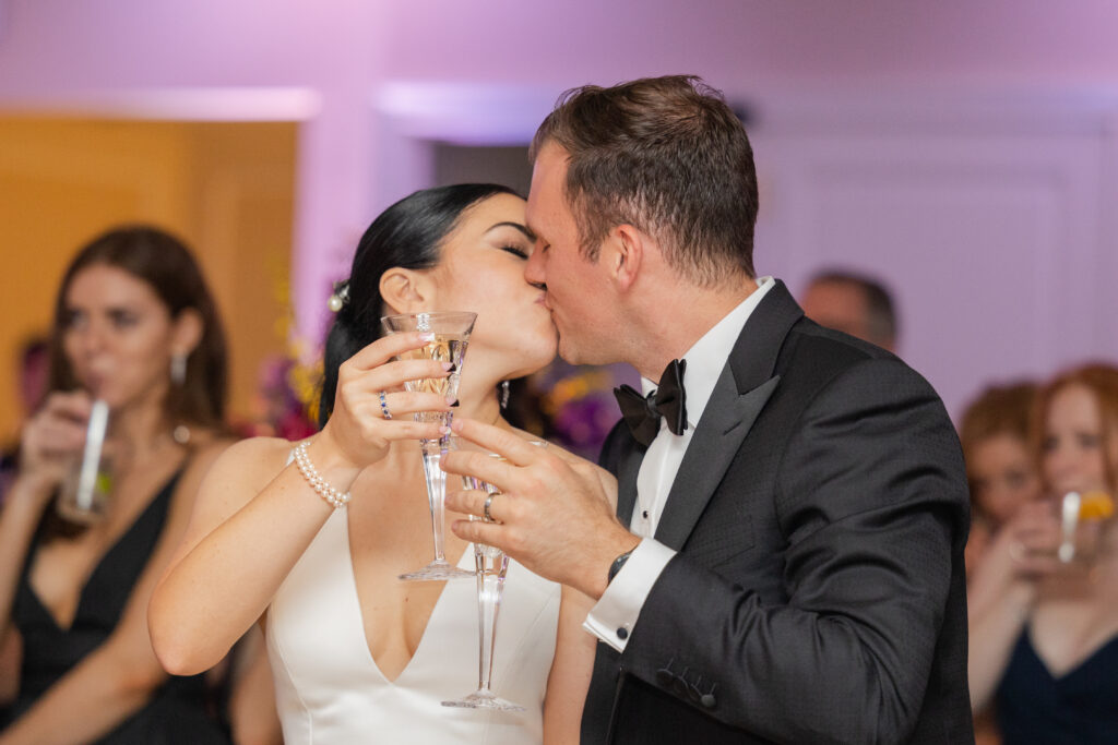 Bride and groom's cheers with a kiss