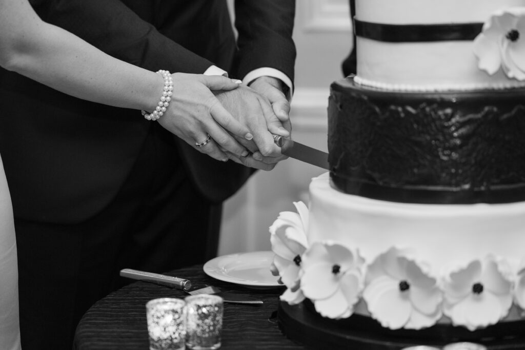 Bride and groom's cutting wedding cake