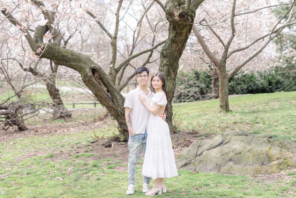 Couple In front of Cherry Blossom Photos at The Pilgrim Hill