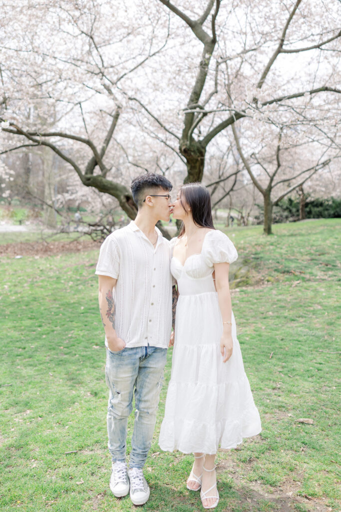 Couple In front of Cherry Blossom Photos at The Pilgrim Hill