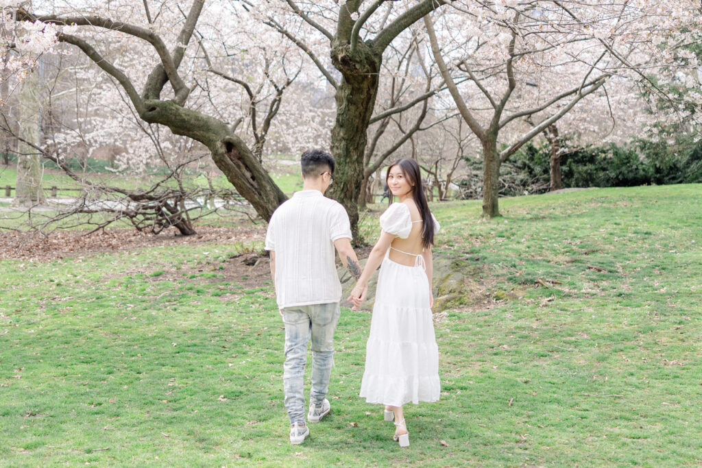 Couple In front of Cherry Blossom Photos at The Pilgrim Hill