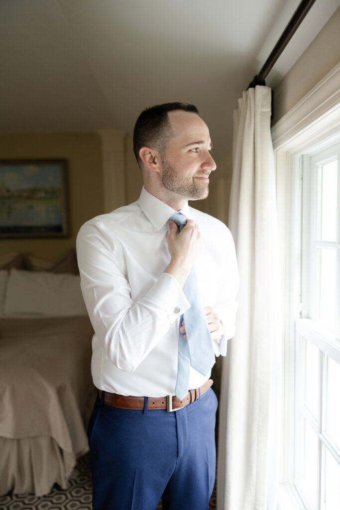 Groom getting ready at Basking Ridge Hotel's suite