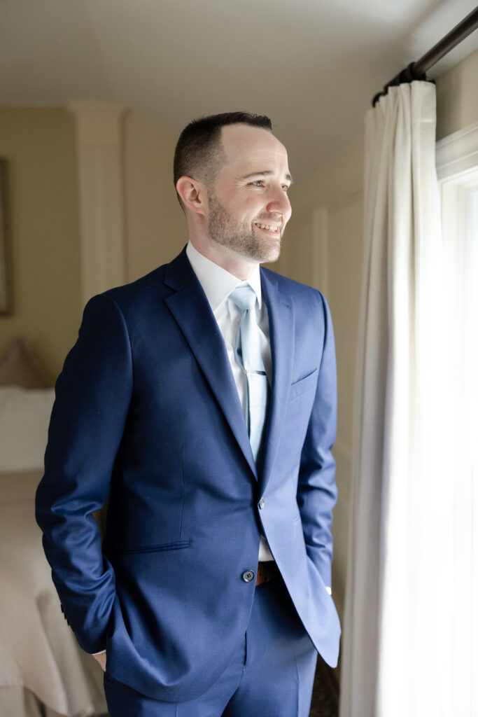 Groom getting ready at Basking Ridge Hotel's suite