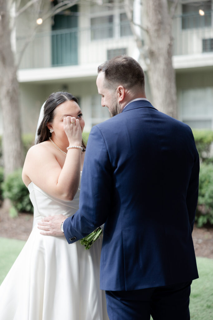 Outdoor first look moment between bride and groom at Olde Mill Inn