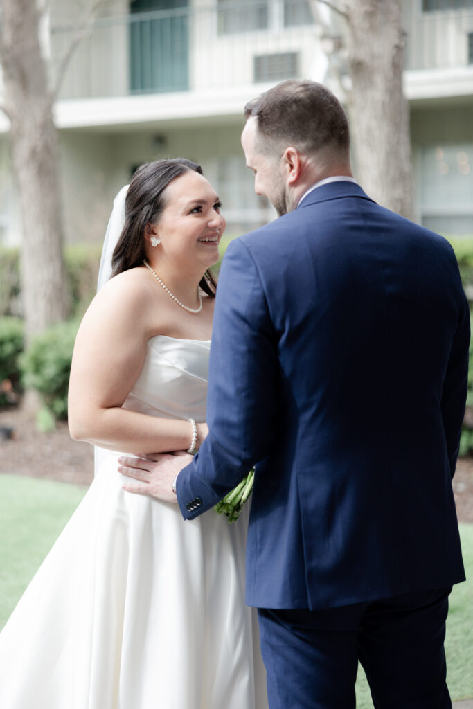 Outdoor first look moment between bride and groom at Olde Mill Inn