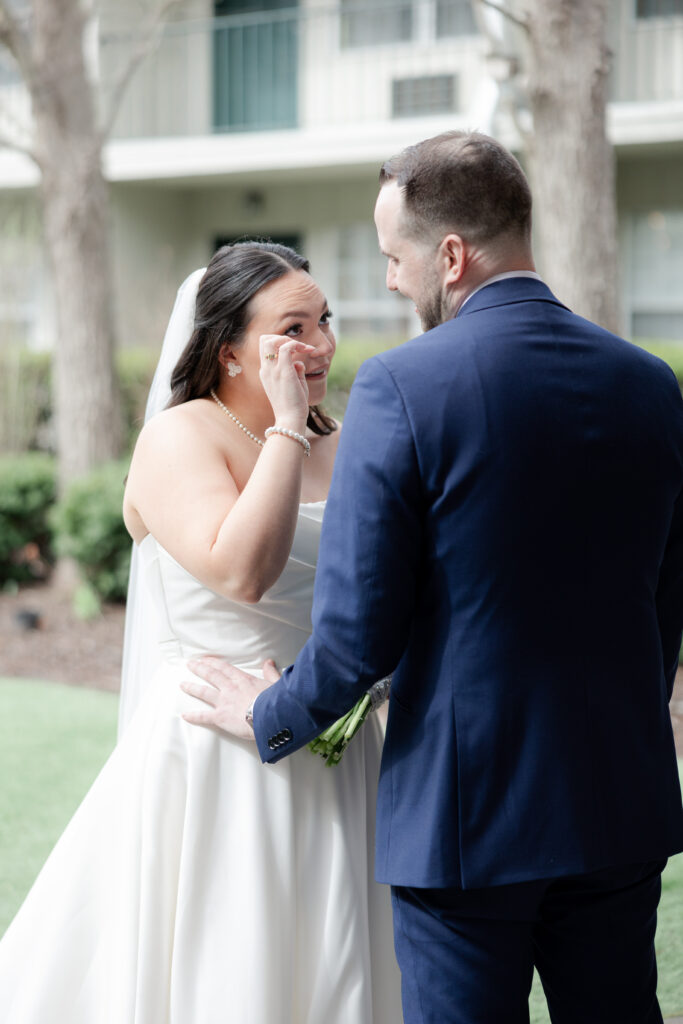 Outdoor first look moment between bride and groom at Olde Mill Inn