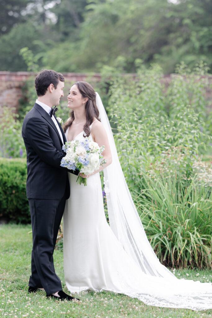 Outdoor bride and groom portraits in garden wedding venue