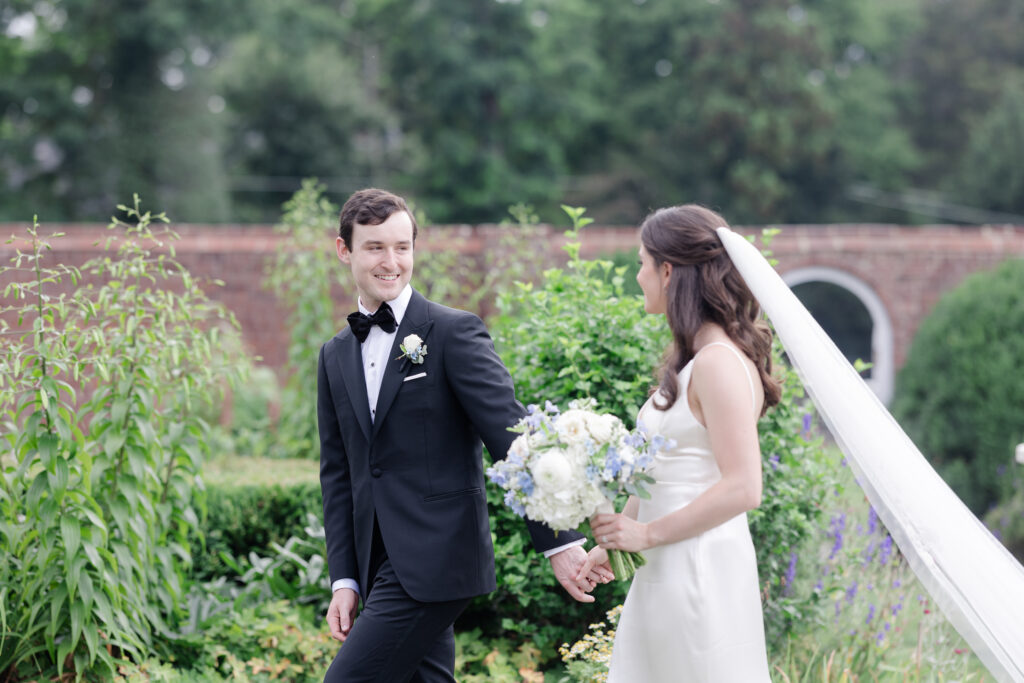 Outdoor bride and groom portraits in garden wedding venue