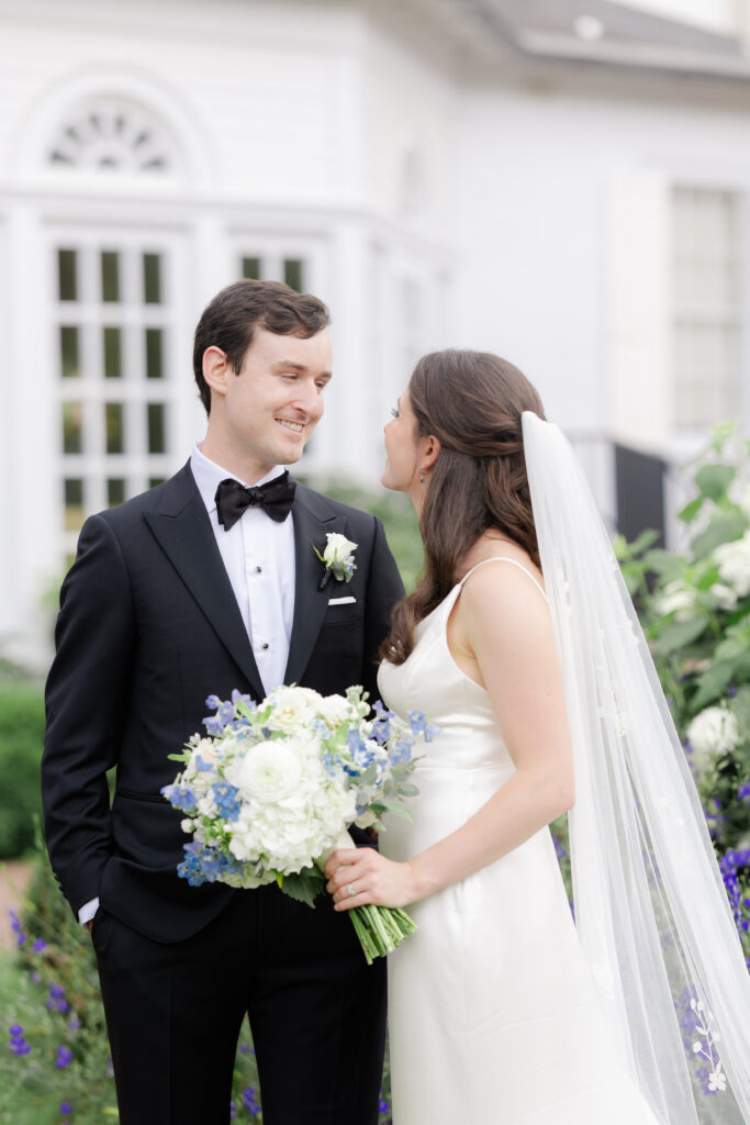 Outdoor bride and groom portraits in garden wedding venue