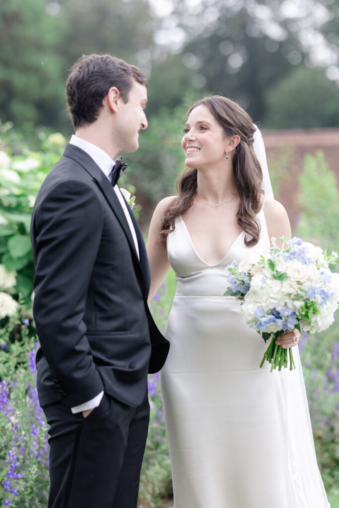 Outdoor bride and groom portraits in garden wedding venue