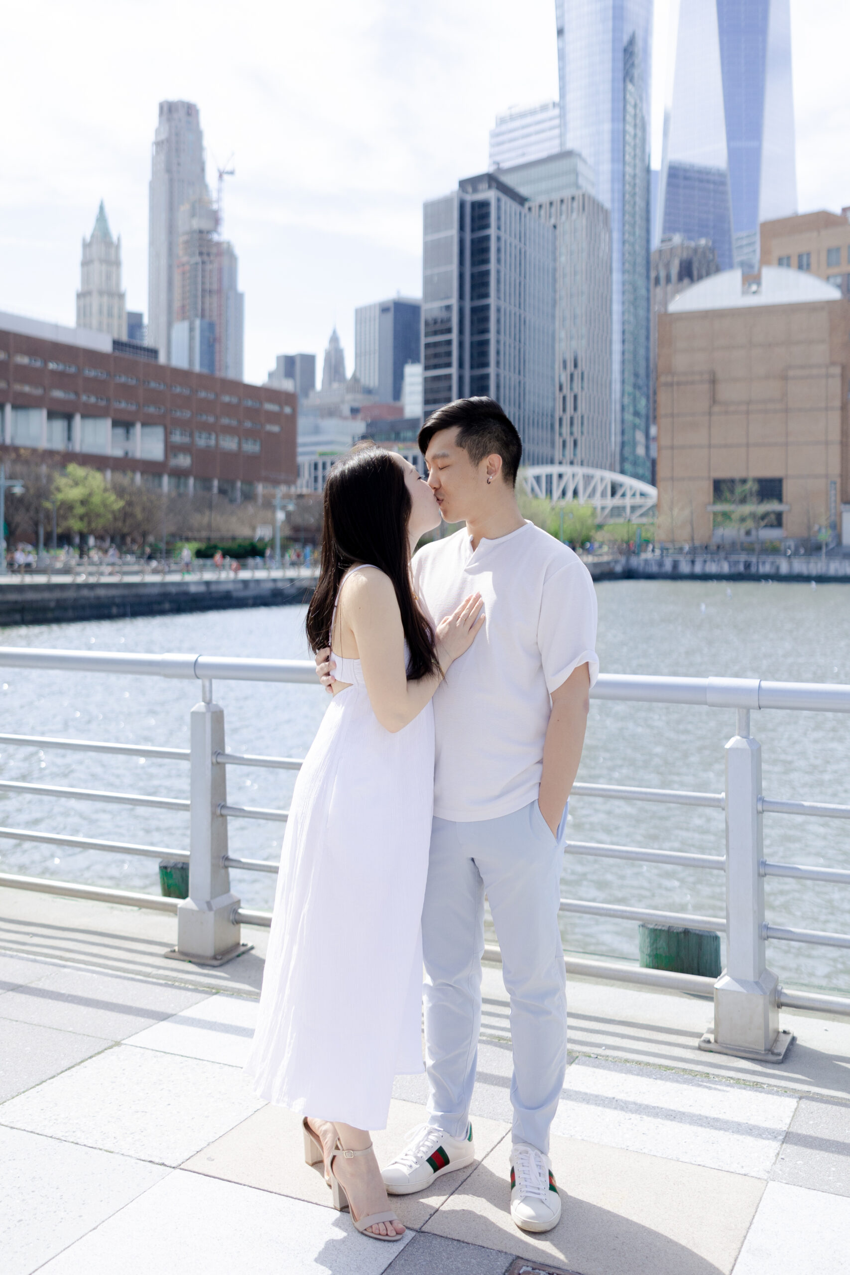 Couple in front of skyscraper skylines at Pier 26, NYC