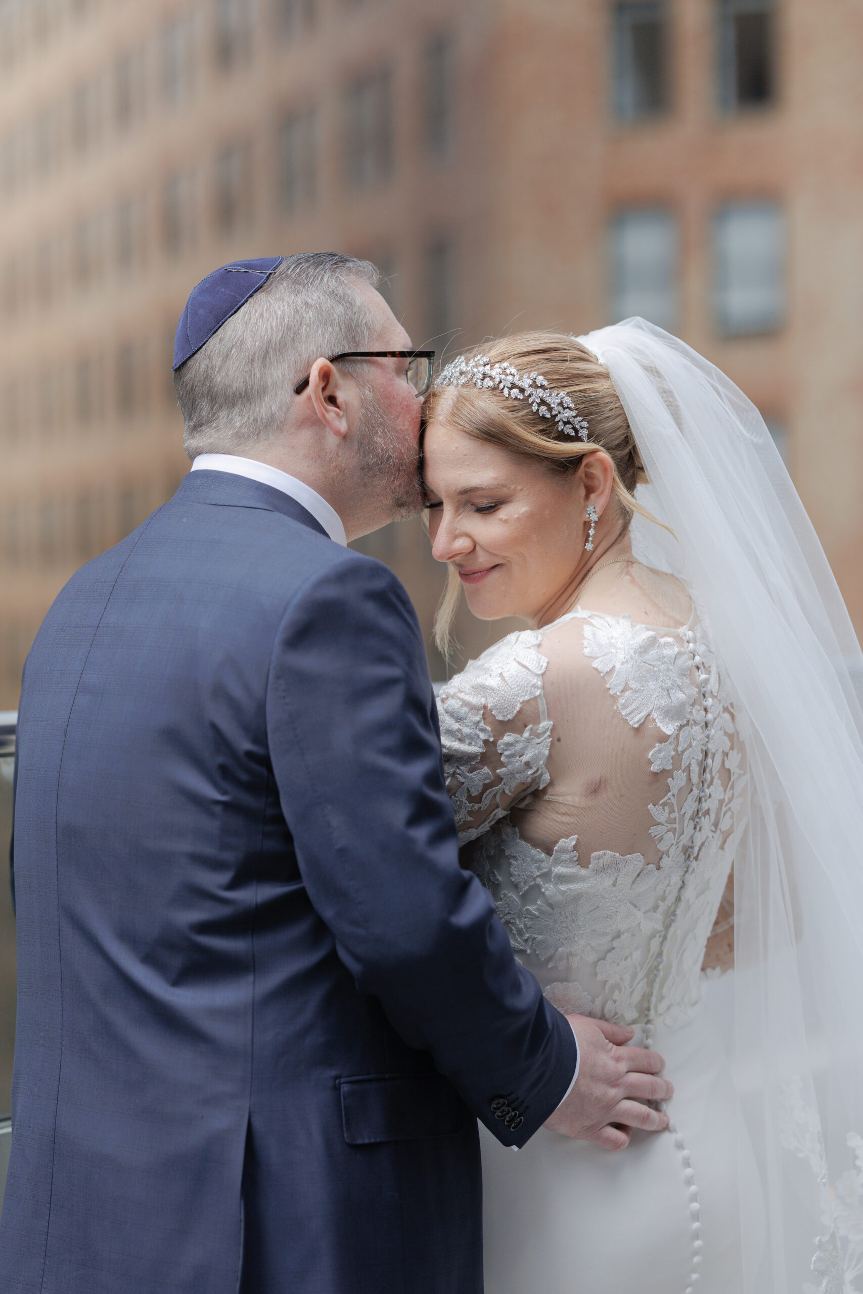 Bride and groom on the balcony of Wall Street Hotel Wedding Venue