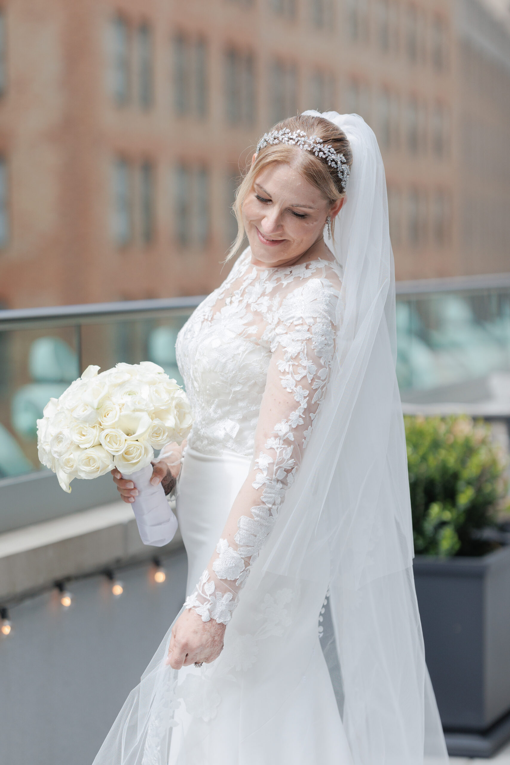 Bride on the balcony of Wall Street Hotel Wedding Venue