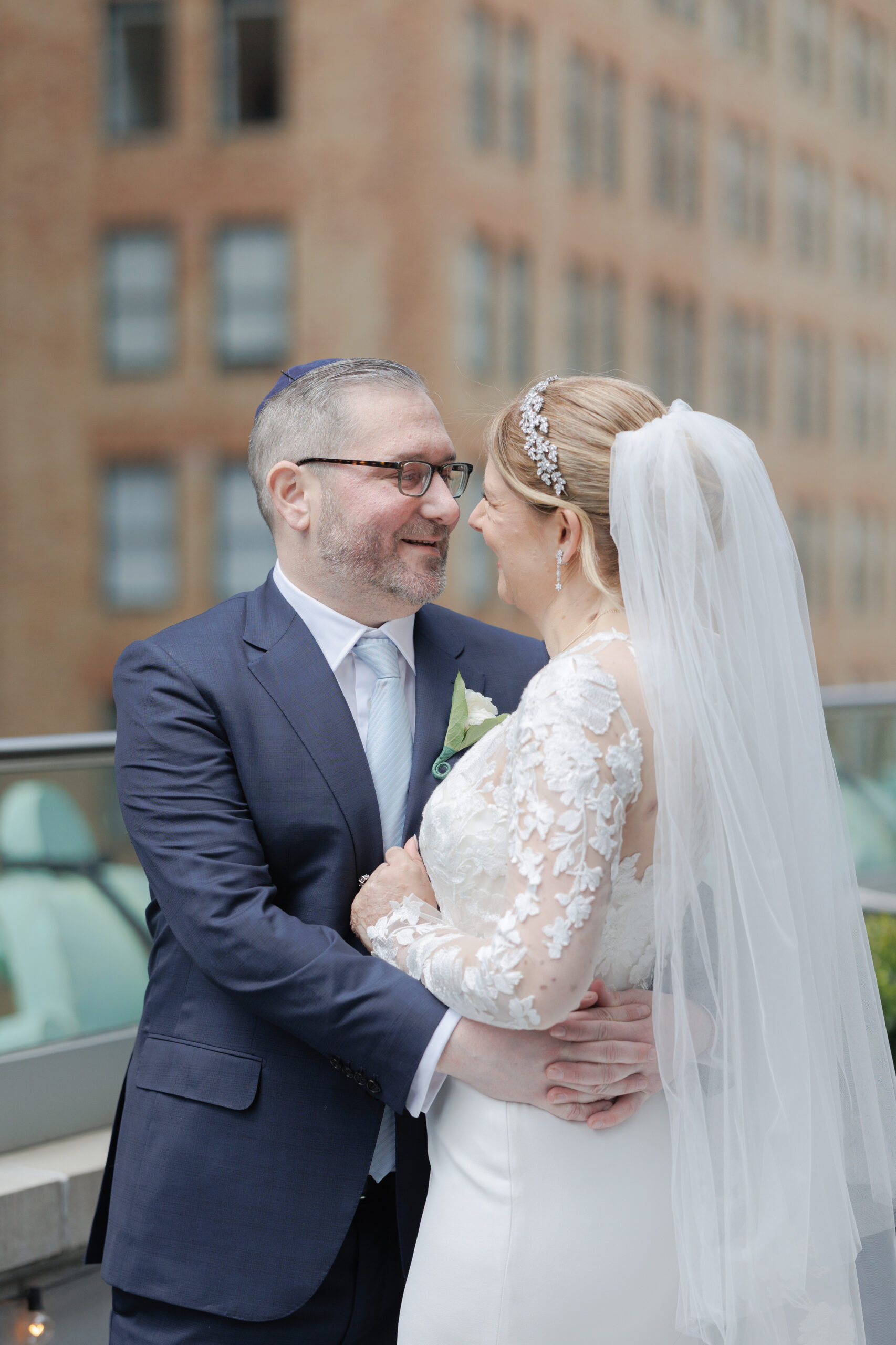 Bride and groom on the balcony of Wall Street Hotel Wedding Venue