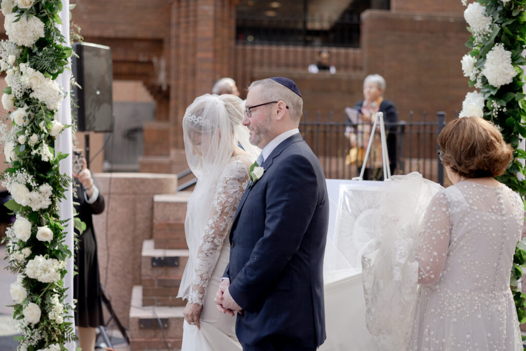 Bride and groom at ceremony aisle at Wall Street Wedding Venue