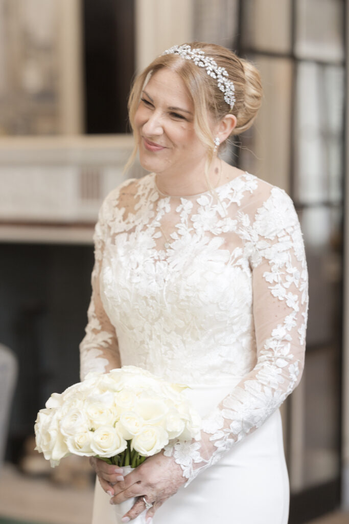 Bride walking inside downtown fidi hotel toward groom for first look