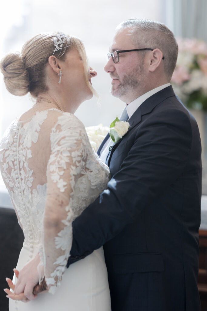 Bride and groom first look inside downtown hotel in fidi nyc