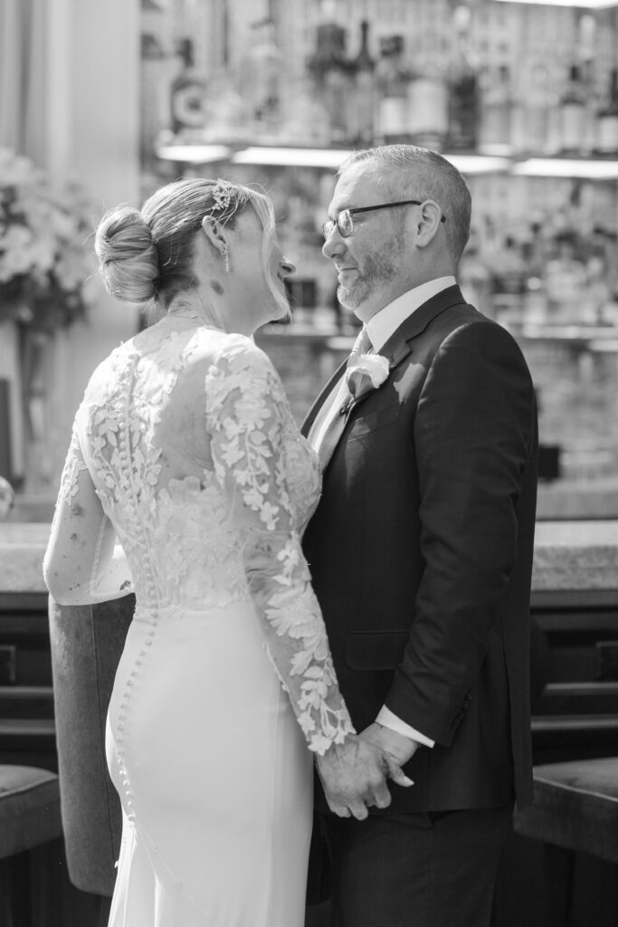 Bride and groom first look inside downtown hotel in fidi nyc