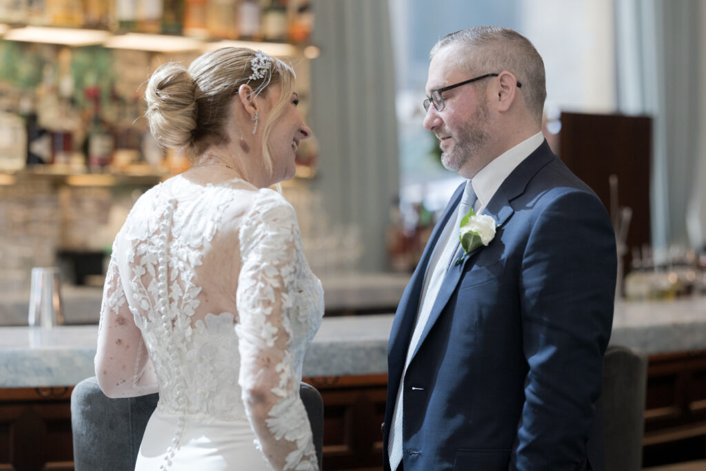 Bride and groom first look inside downtown hotel in fidi nyc