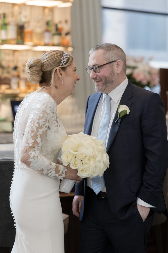 Bride and groom first look inside downtown hotel in fidi nyc