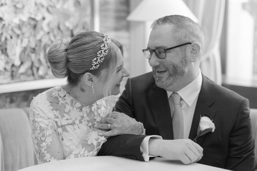 Bride and groom sitting down portrait