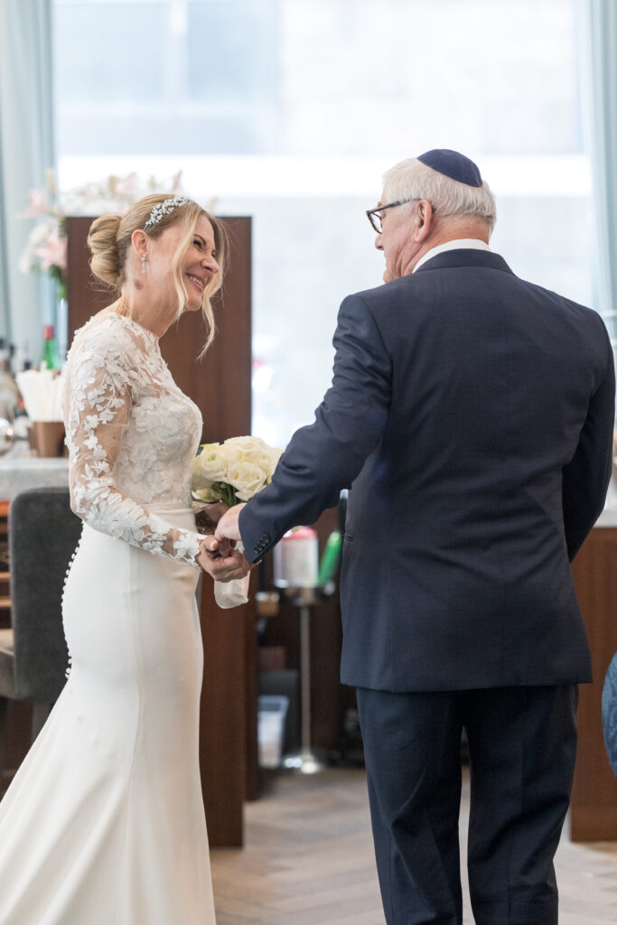 Bride and dad first look inside fidi hotel wedding venue