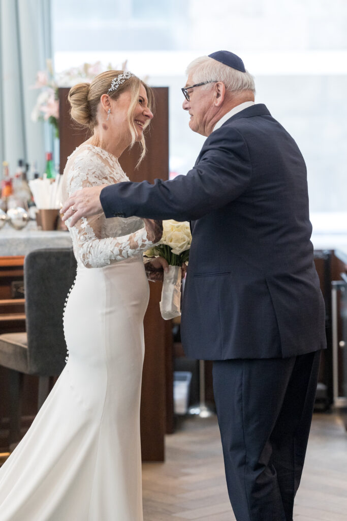 Bride and dad first look inside fidi hotel wedding venue