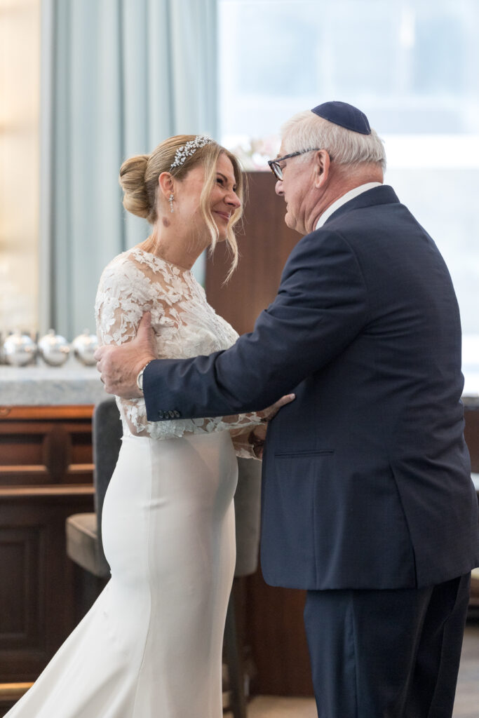 Bride and dad first look inside fidi hotel wedding venue