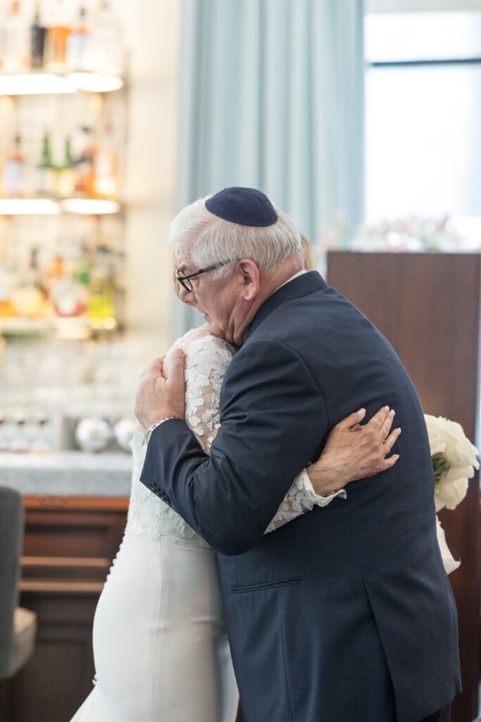 Bride and dad first look inside fidi hotel wedding venue