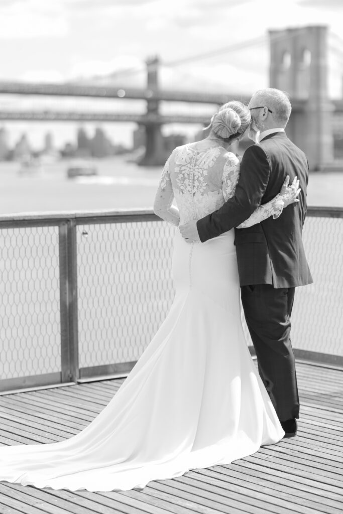 Bride and groom in front of Brooklyn Bridge at Pier 16