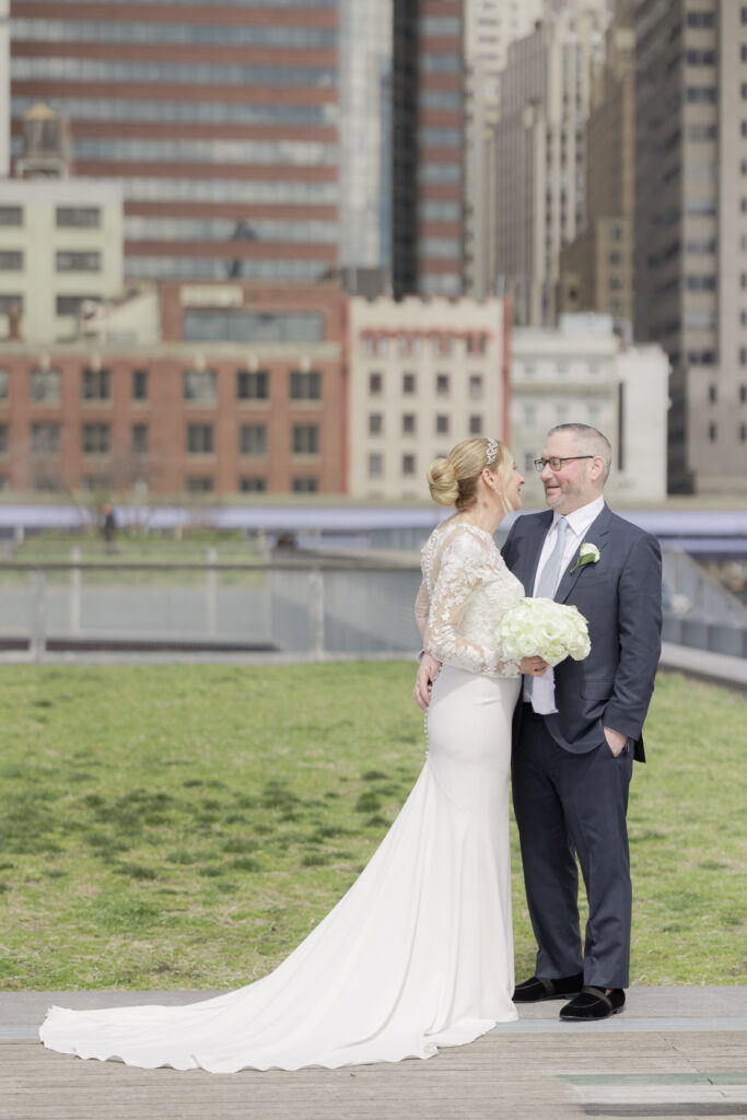 Bride and groom against skyscraper backdrop