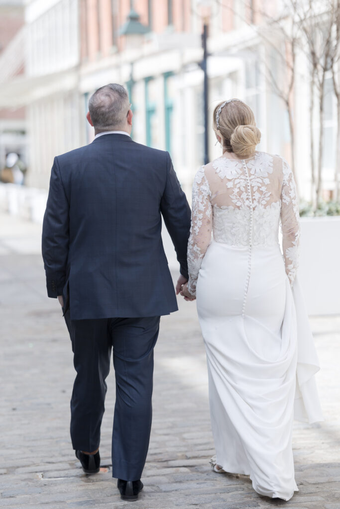 Bride and groom walking in Financial District area