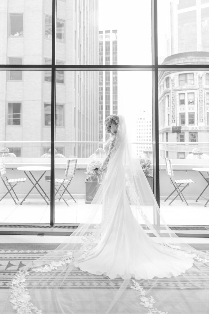 Bride on the balcony of Wall Street Hotel Wedding Venue