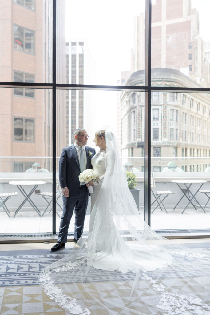 Bride and groom on the balcony of Wall Street Hotel Wedding Venue