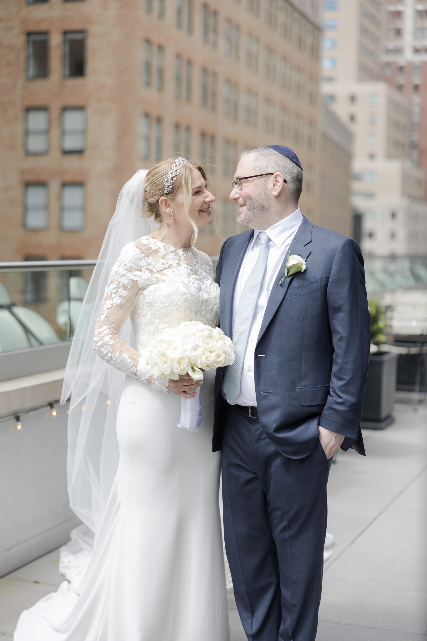 Bride and groom on the balcony of Wall Street Hotel Wedding Venue