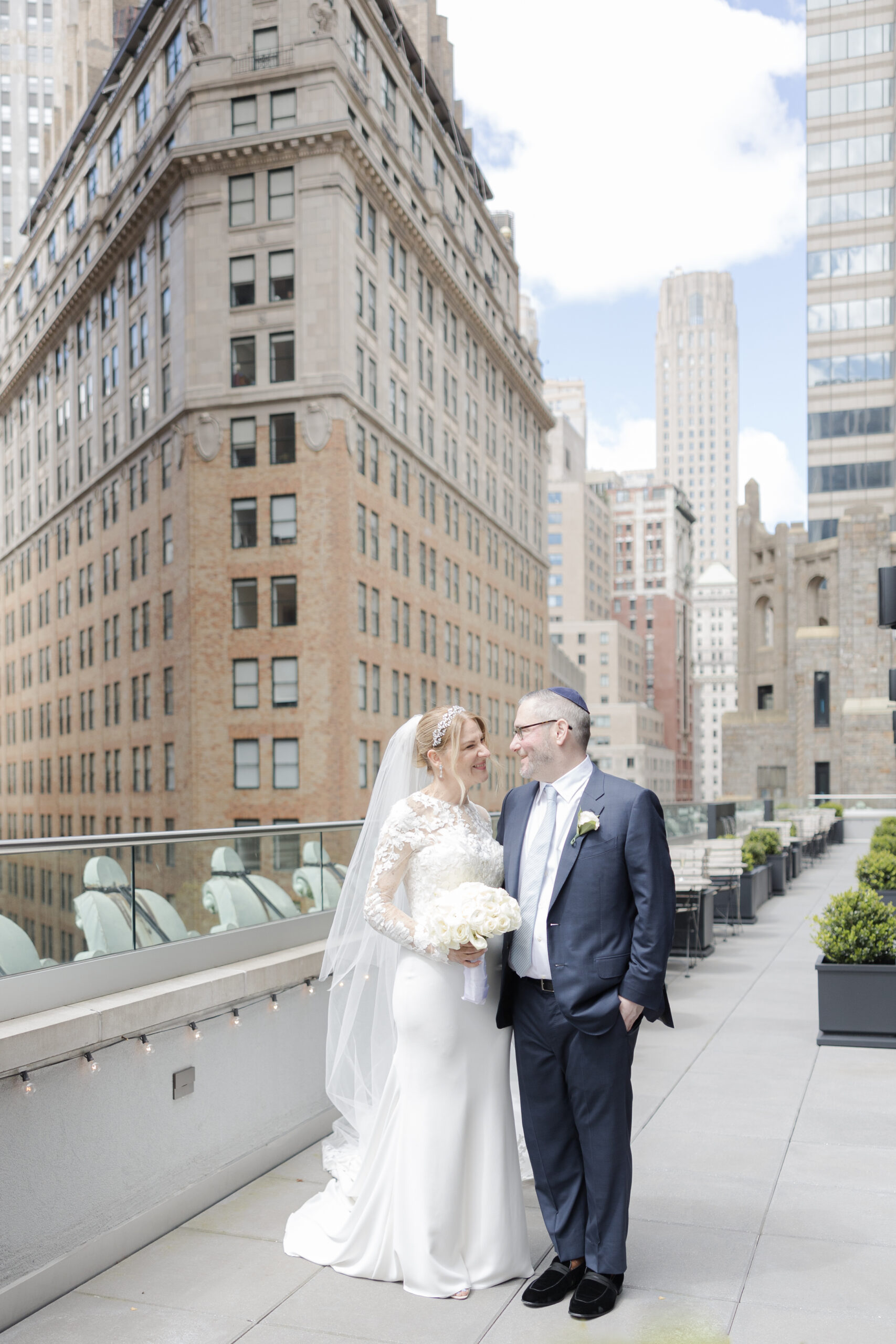 Bride and groom on the balcony of Wall Street Hotel Wedding Venue