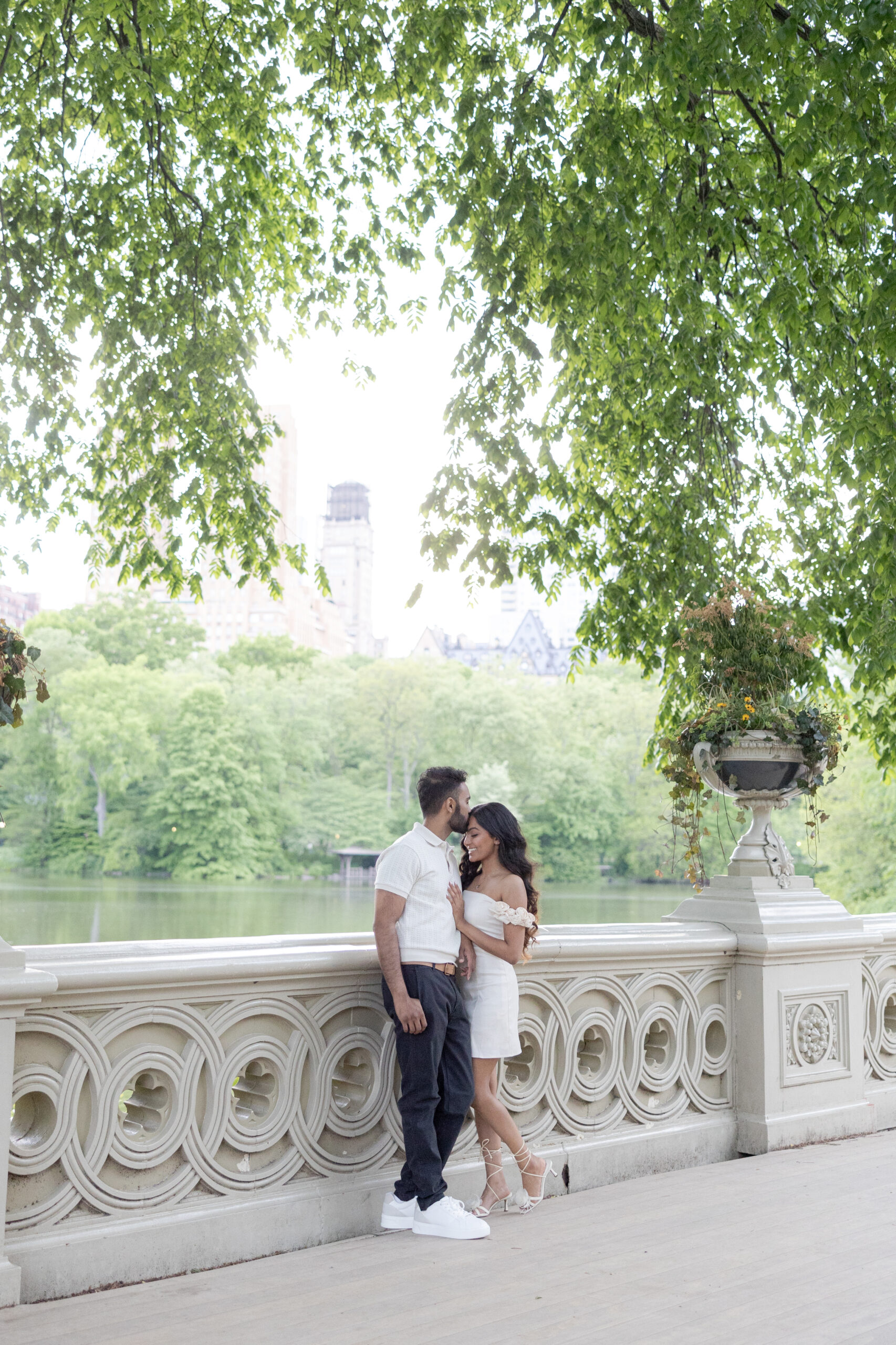 Romantic Spring Engagement Photos in NYC Bow Bridge