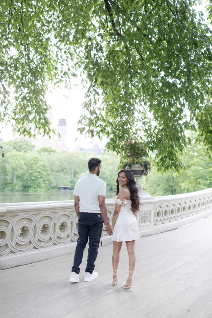 Romantic Spring Engagement Photos in NYC Bow Bridge